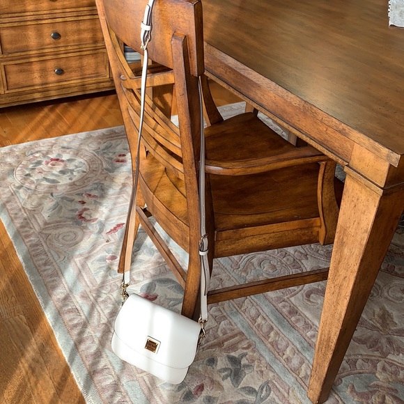 EUC Dooney and Bourke cream Leather Crossbody fold over satchel. Zip on back. - Picture 8 of 8